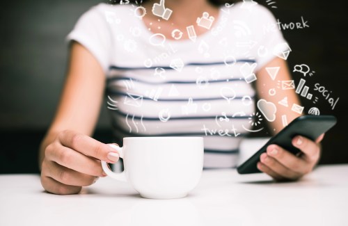 woman holding coffee cup