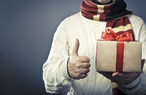 person holding holiday gift box