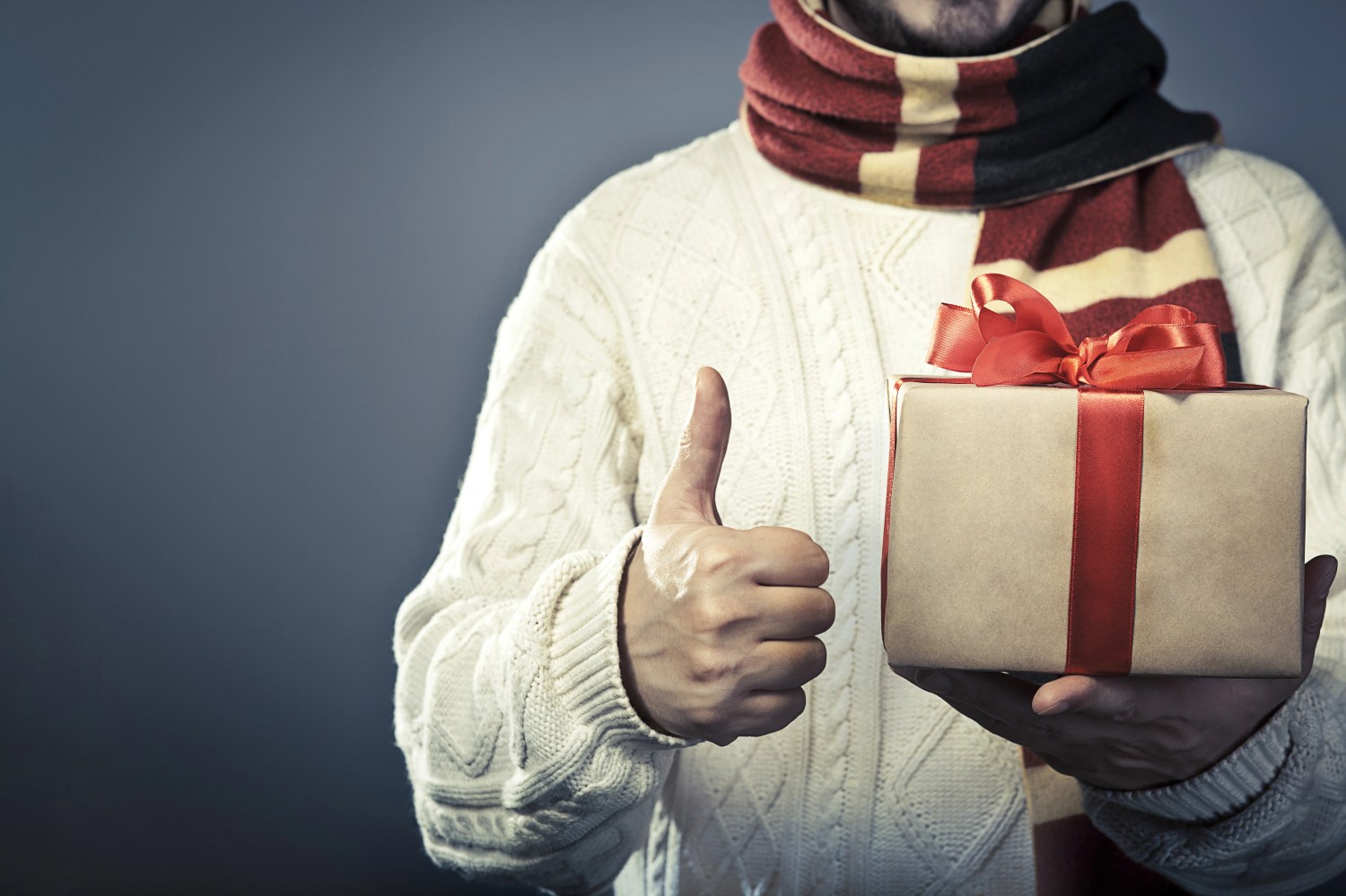 person holding holiday gift box